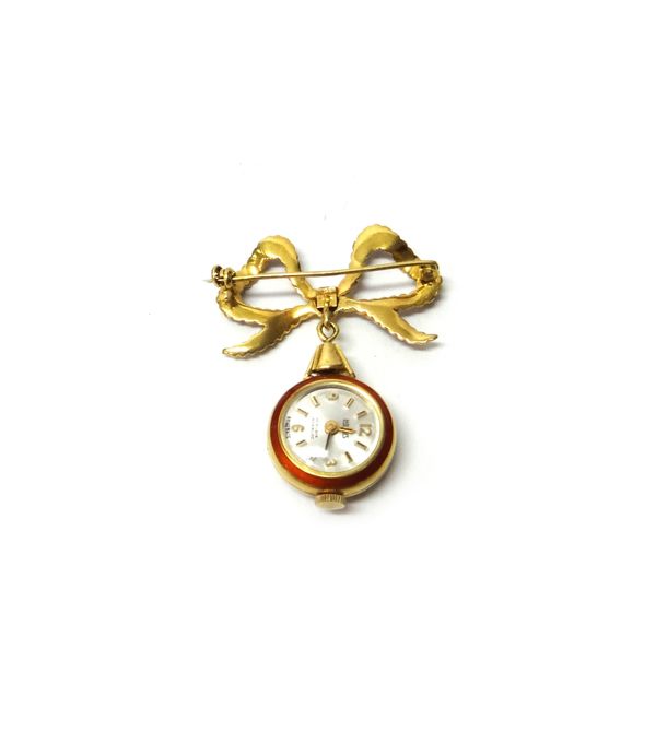 A lady's gold cased and red enamelled openfaced brooch watch, with a jewelled Swiss movement, the silvered dial detailed Horus, detailed within the ca