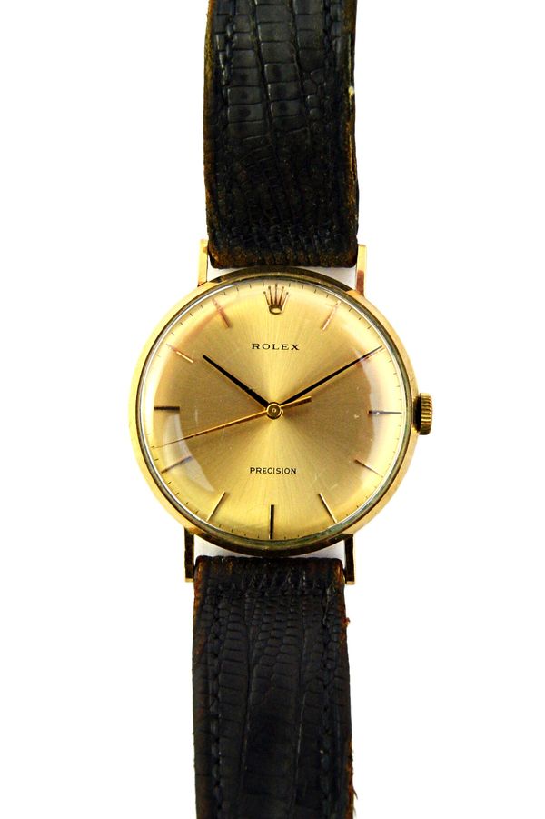 A gentleman's 9ct gold circular cased Rolex Precision wristwatch, the signed circular dial with baton shaped numerals, Rolex crown at 12 o'clock, blac