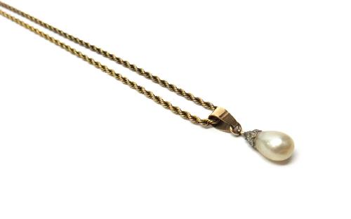 A gold ropetwist link neckchain, detailed 9 C, on a cylindrical clasp and a rose diamond capped drop shaped cultured pearl pendant, combined gross wei