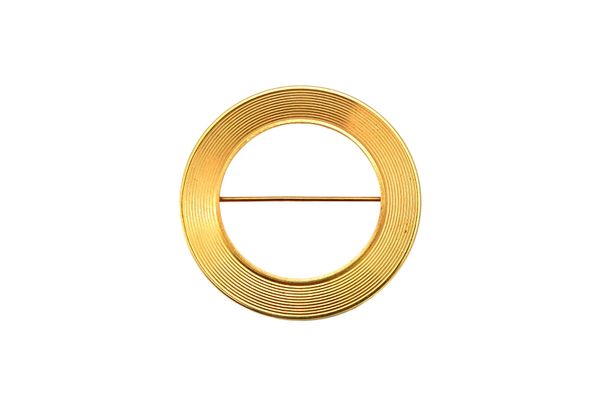 A Cartier gold brooch, of circular form, with concentric decoration, detailed Cartier 14 K 21331, diameter 3.7cm, weight 8 gms. Illustrated