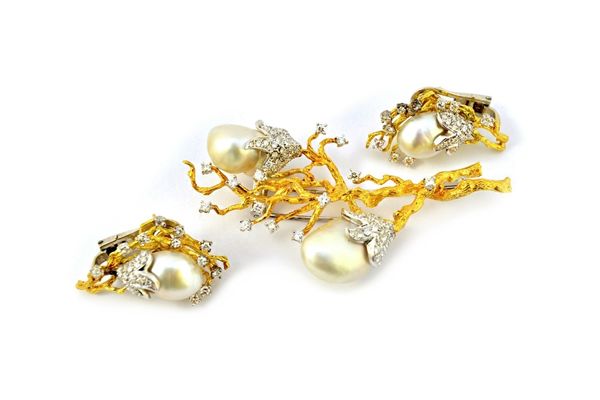 A gold, diamond and cultured pearl set brooch, in a marine spray design, the two flowers each mounted with a large baroque cultured pearl, otherwise m