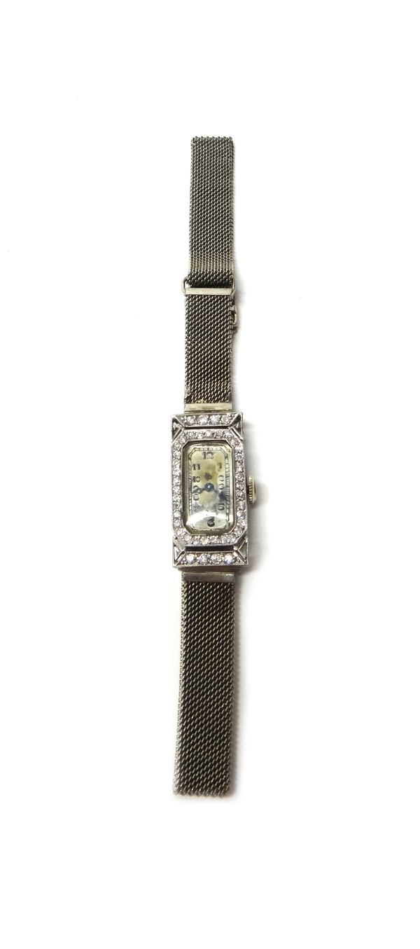 A lady's platinum rectangular cased and diamond set Jules Jurgensen, Copenhagen & Switzerland dress wristwatch, with a signed jewelled movement, the s