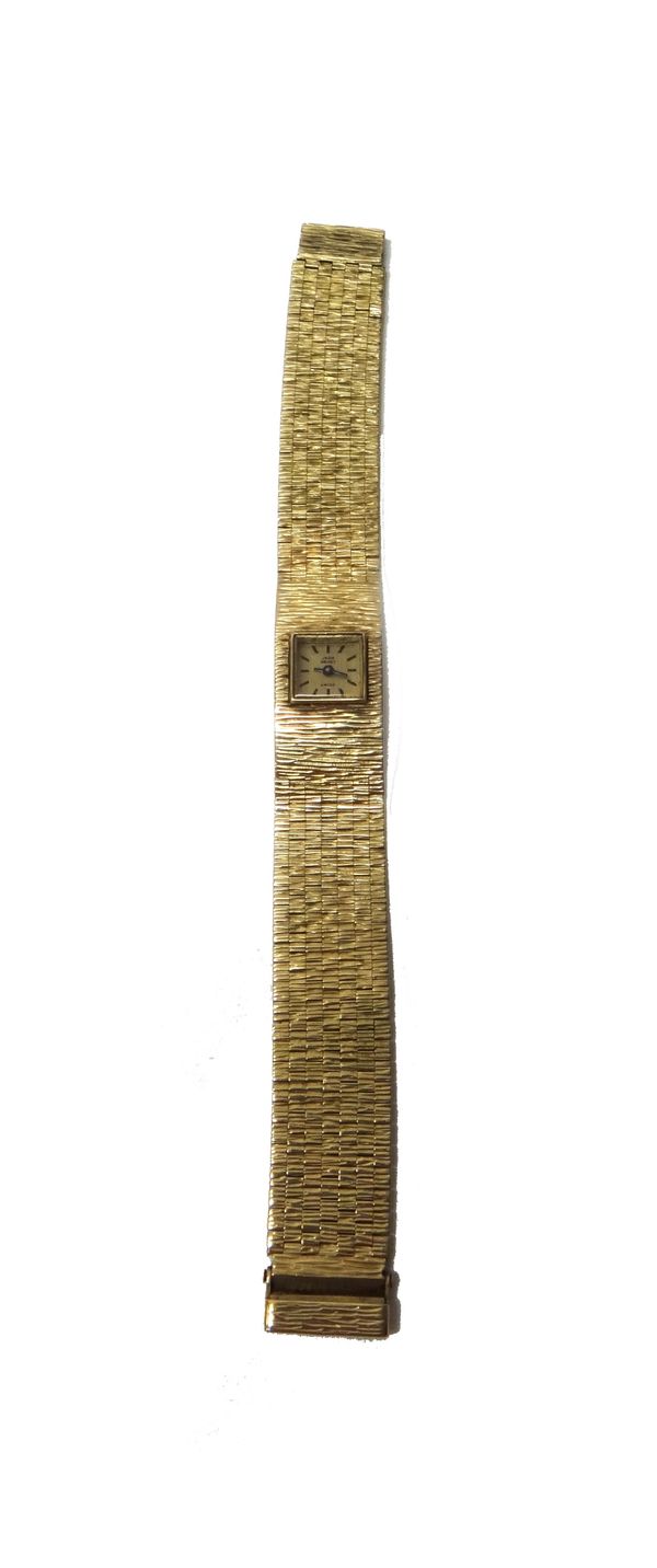 A lady's 9ct gold Jean Renet bracelet wristwatch, the signed square textured gilt dial with black baton shaped numerals, on a bark textured brick link