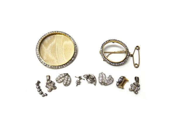 A gold and diamond set circular brooch frame, the front mounted with a border of cushion shaped diamonds and the back monogram engraved, frame diamete