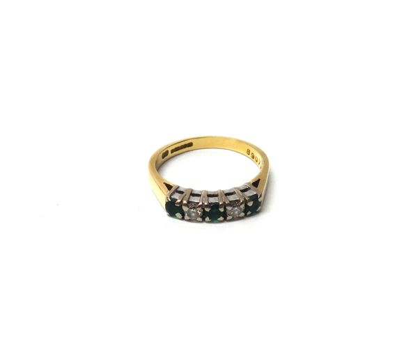 An 18ct gold, emerald and diamond set five stone ring, mounted with three circular cut emeralds, alternating with two circular cut diamonds, ring size