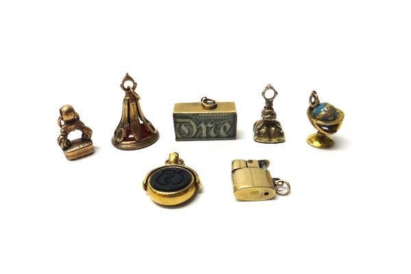 A gold mounted bloodstone and sardonyx set rotating fob seal, a cornelain set pendant fob seal, two further Victorian seals, a gold lighter charm deta