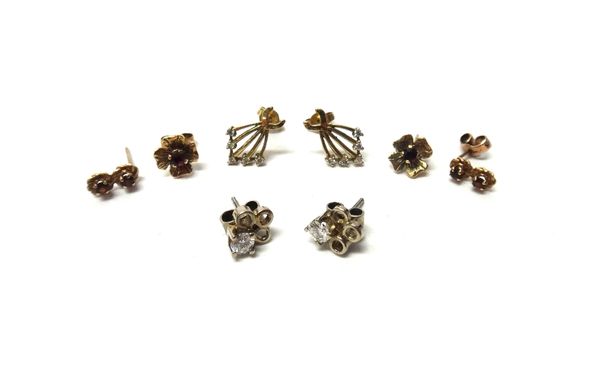 A pair of diamond set single stone earstuds,each in a triple loop design, claw set with a circular cut diamond, the backs with post and butterfly clip