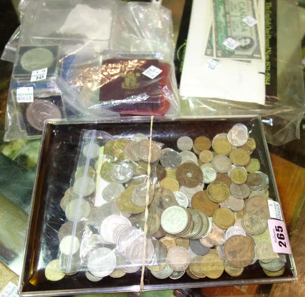 A quantity of mainly British coinage and banknotes, together with a group of foreign coins. (qty)