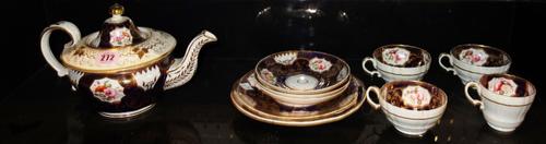 A Victorian gilt and floral part decorated tea set.