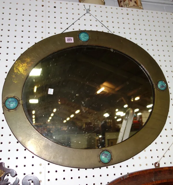 A 20th century oval copper mirror with turquoise enamel decoration together with a walnut oval mantel with cross banded decoration. (2)