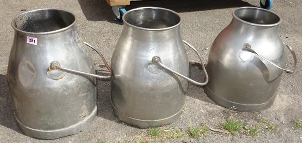 A group of three 20th century chrome milk churns.