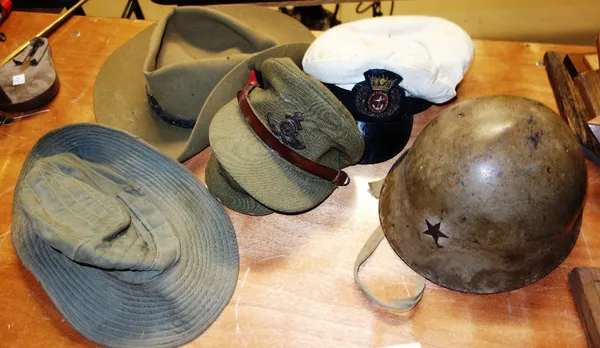 A quantity of assorted naval and military hats. (qty)