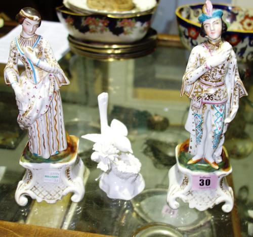 A pair of Continental porcelain figures of a male and female (a.f), together with a Crown Staffordshire white glaze bird figure. (3)
