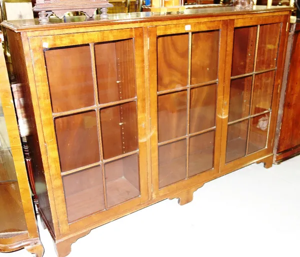 A mahogany three door glazed bookcase, 167cm.