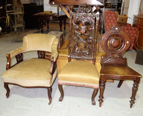 A Victorian low chair, a 17th century style oak high back chair and a Victorian mahogany hall chair. (3)