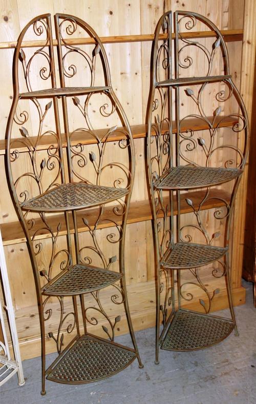 A green painted metal garden shelf and another. (2)