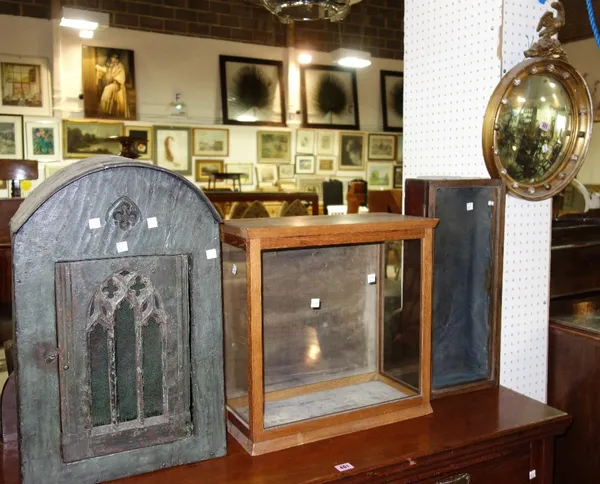 A Regency style gilt convex mirror with eagle surmount, two glazed cabinets and a 16th century style painted wall hutch (4)