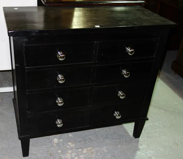 A pair of black stained pine chest of drawers, each with eight small drawers, 77cm wide. (2)