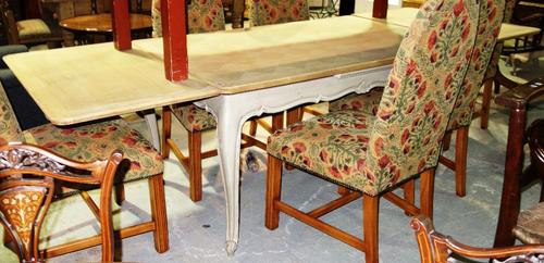 An oak drawleaf dining table with grey painted base, 258cm extended.