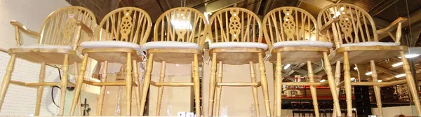 A set of six pine spindle back dining chairs to include a pair of carvers. (6)