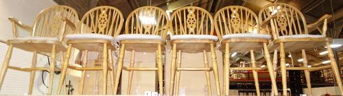 A set of six pine spindle back dining chairs to include a pair of carvers. (6)