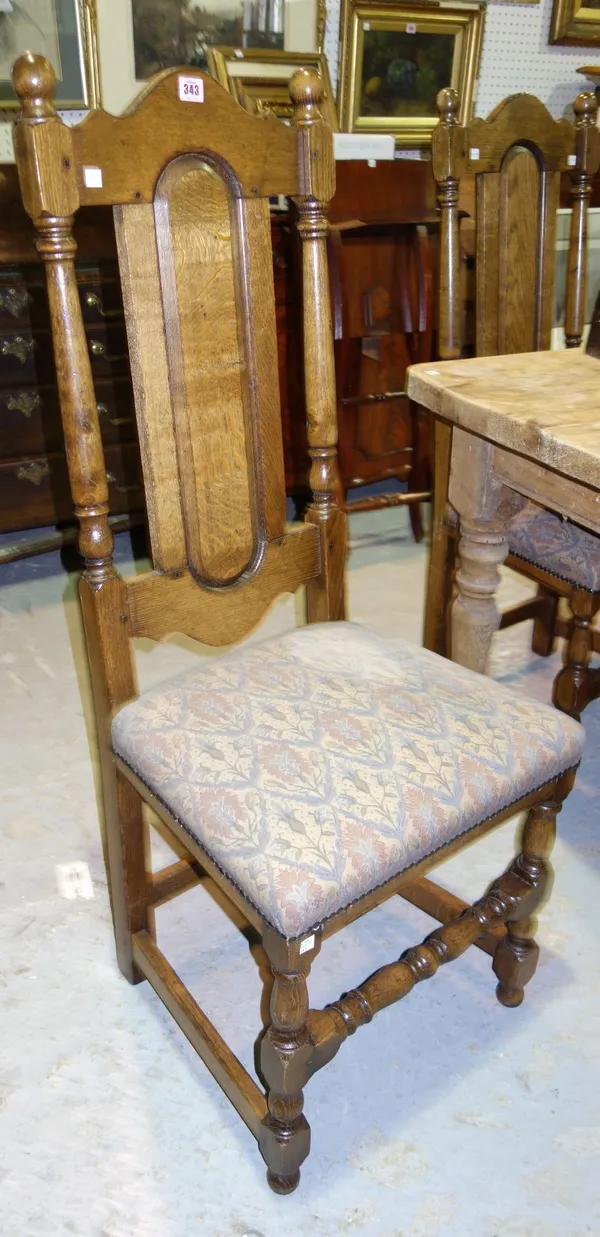 A set of six oak dining chairs in the 17th century style.