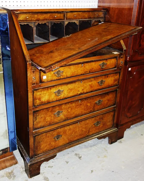A 19th century burr walnut bureau with four drawers and fitted interior, 72.5cm wide. (a.f)