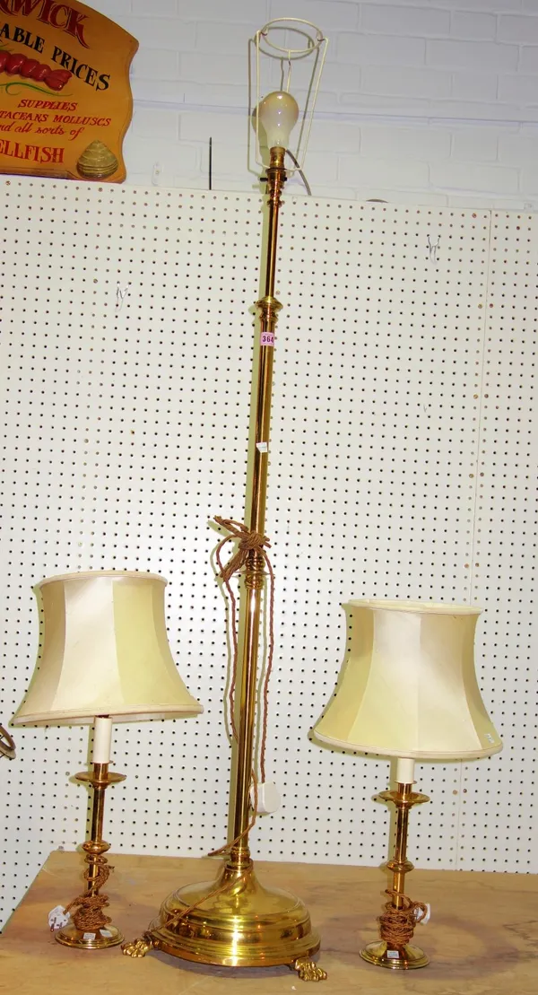A 20th century brass standard lamp and a pair of brass table lamps,(3).