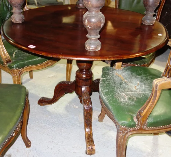A mahogany circular tilt top table.