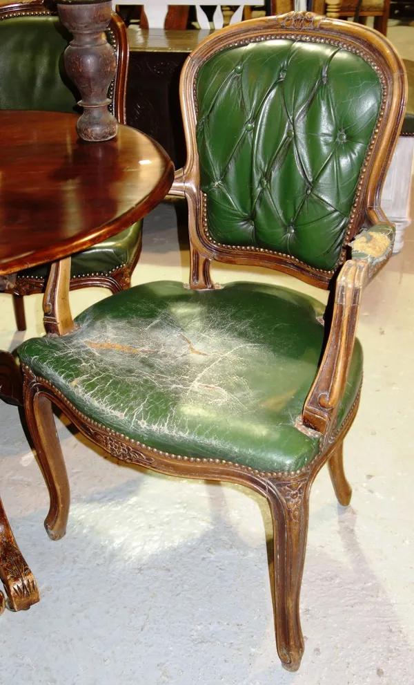 A pair of green leather upholstered fauteuils and two single chairs. (4)