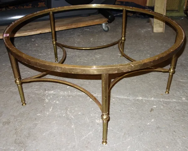 A circular brass coffee table base.