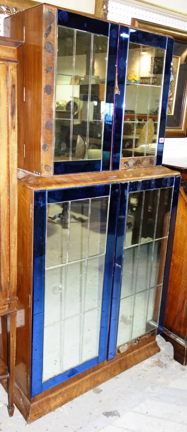 A 20th century walnut and glass cocktail cabinet, 83cm. (a.f.)