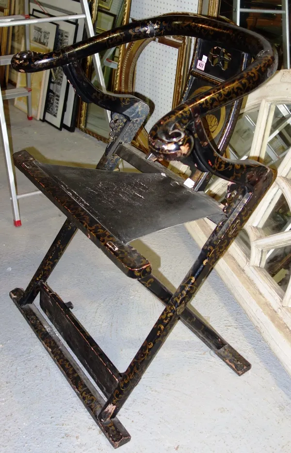 A late 19th/early 20th century Chinese black lacquer, chinoiserie decorated folding horseshoe back chair.