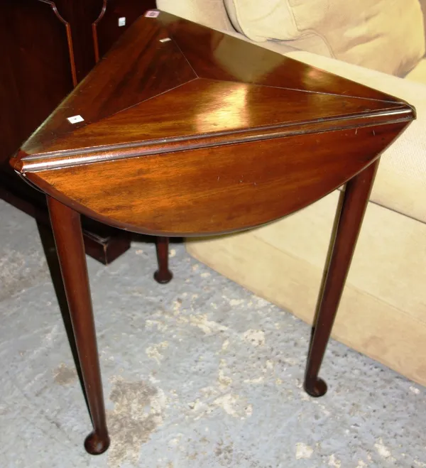 A 19th century mahogany triangular drop flap table, 69cm.