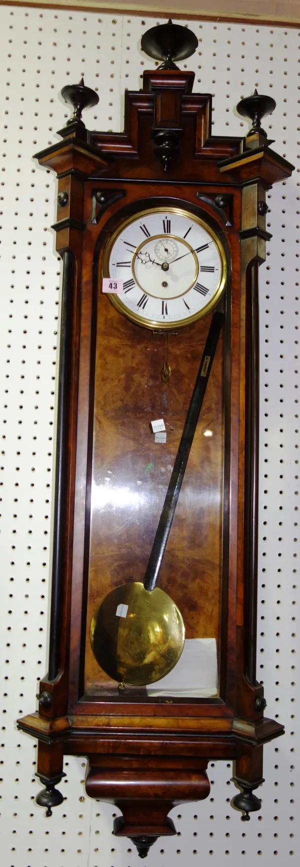 A walnut cased wall clock.