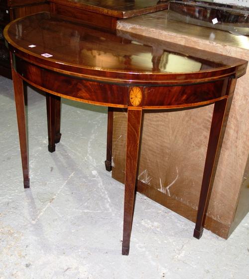 A George III demi-lune mahogany foldover card table, 96cm wide.