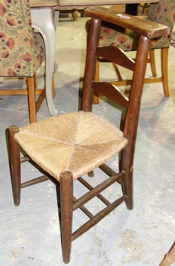A set of four rush seated ladder back dining chairs. (4)
