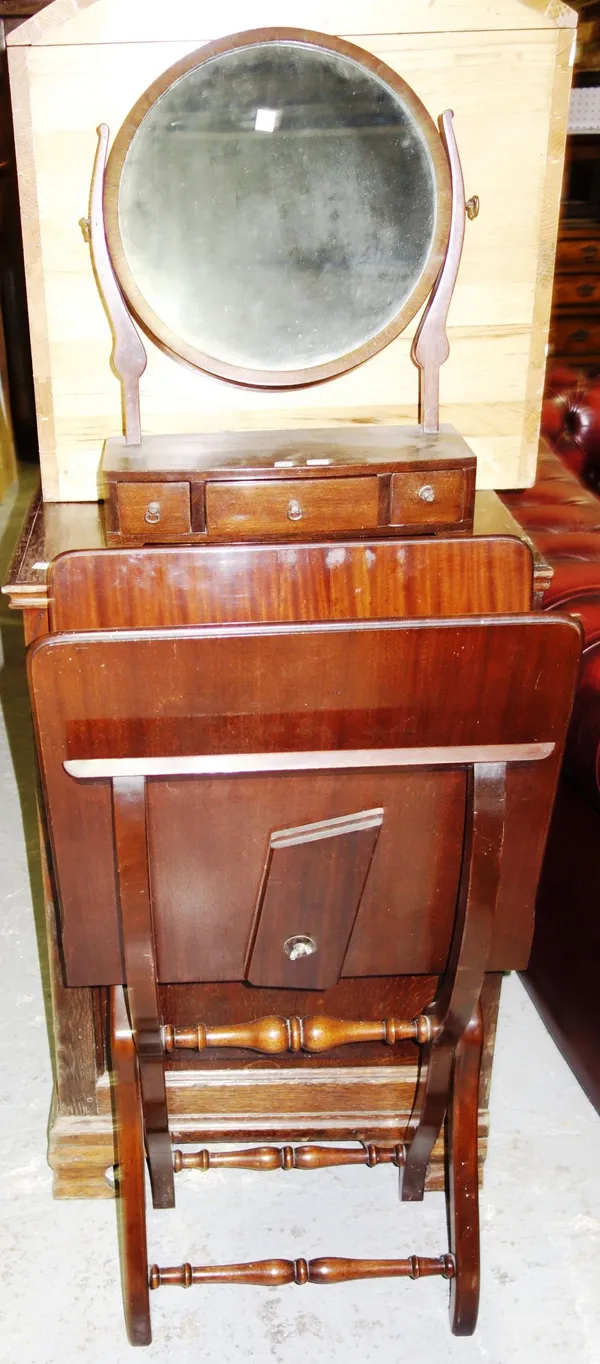 A mahogany folding coaching table and a mahogany circular toilet mirror with three drawer base. (2)  32, 35