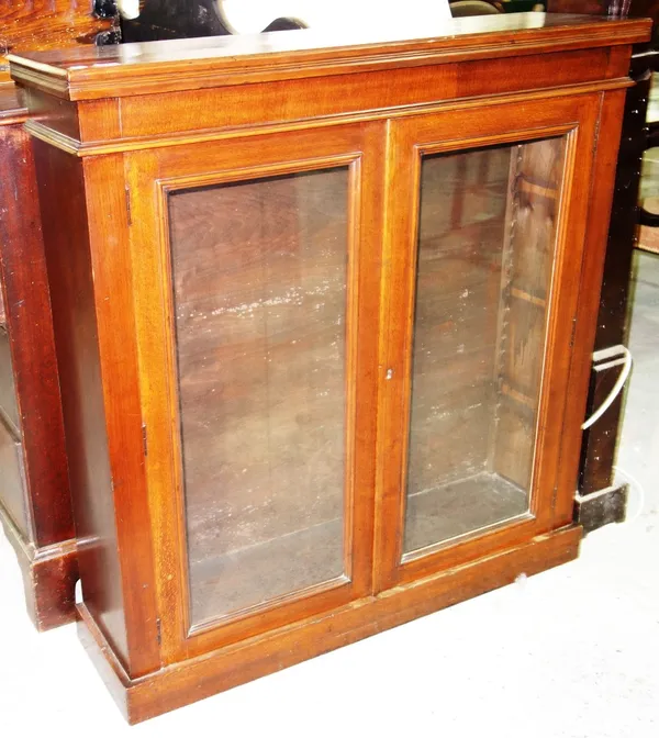 A Victorian glazed oak two door floor standing bookcase, 103.5cm.