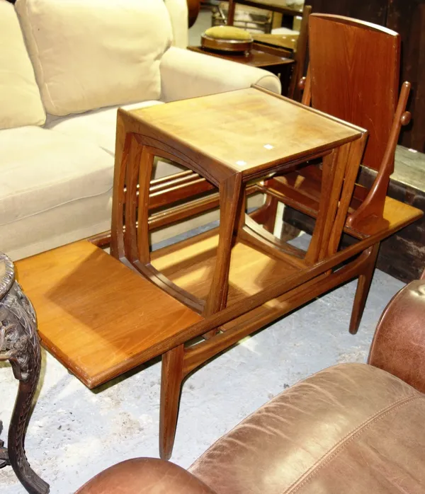 A 20th century G-plan coffee table, a nest of three tables and a toilet mirror. (3)