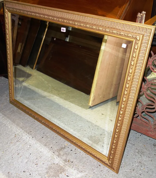A gilt framed rectangular mirror.