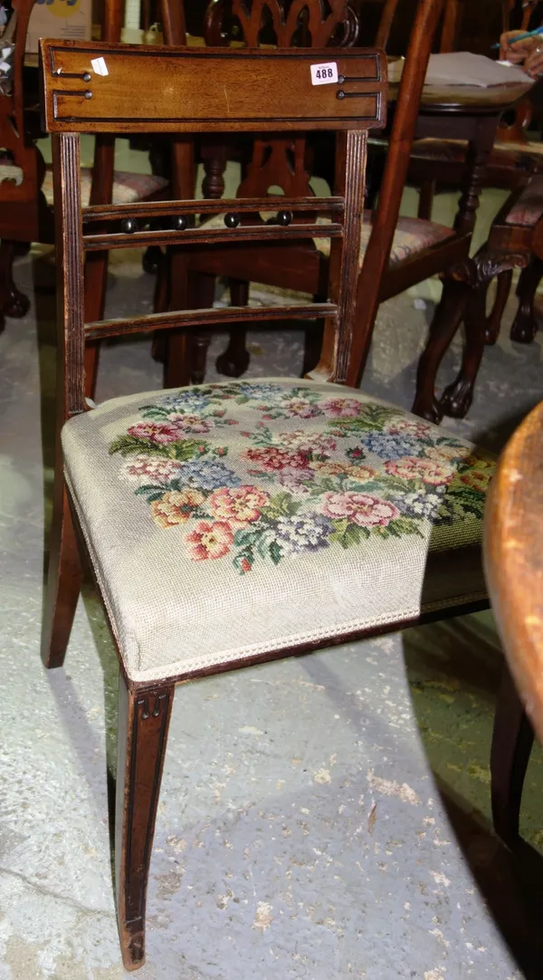 A set of four Regency mahogany dining chairs with floral tapestry stuffed seats, (4).