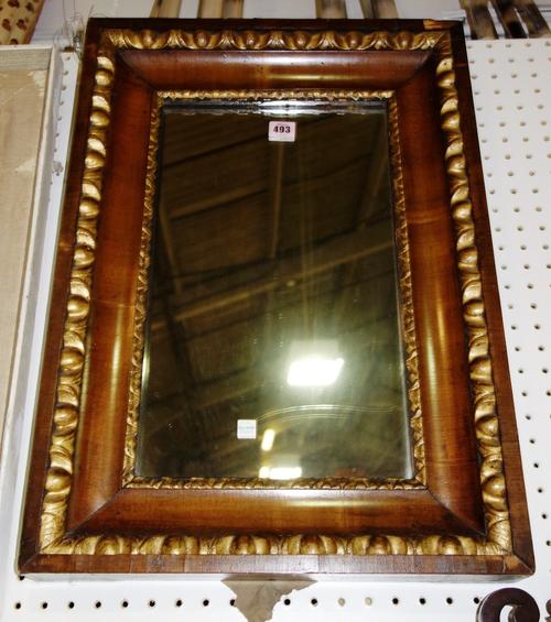 An early 18th century Flemish walnut and parcel gilt wall mirror, 64cm x 45.5cm.
