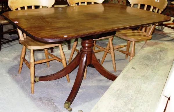 A Regency mahogany breakfast table, the rectangular snap top on turned column and four downswept supports, 84cm wide x 142cm high.