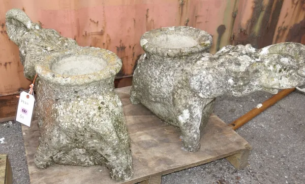 A pair of reconstituted stone pots formed as elephants.