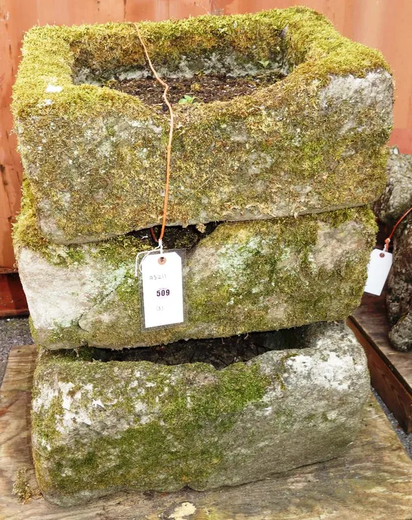 A group three rectangular small stone troughs.