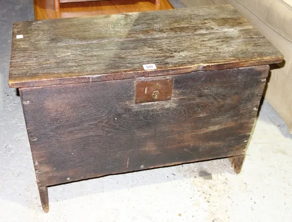A small 17th century and later oak plank coffer, on slab end supports, 72cm wide.