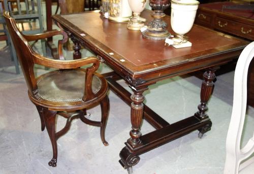 A mahogany framed rectangular centre writing table, with four frieze drawers on fluted baluster supports, united by 'H' frame stretcher, 117cm wide, t