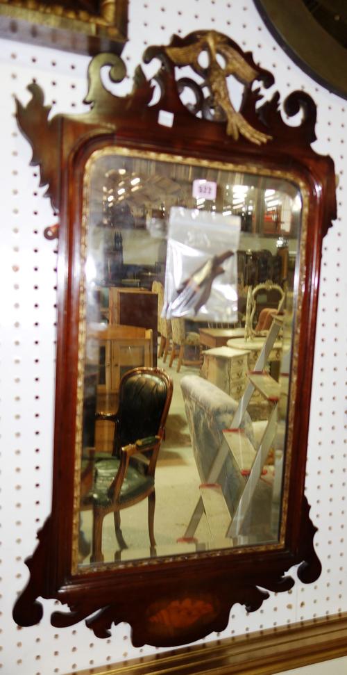 A 19th century parcel gilt mahogany fret cut pier glass, with hoho bird crest and conch shell inlaid lower frieze, 50cm wide x 91cm high.