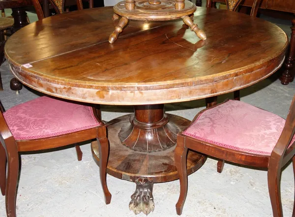 A William IV rosewood breakfast table, the circular snap top on turned column and flared circular base on three lions paw feet, 122cm wide.